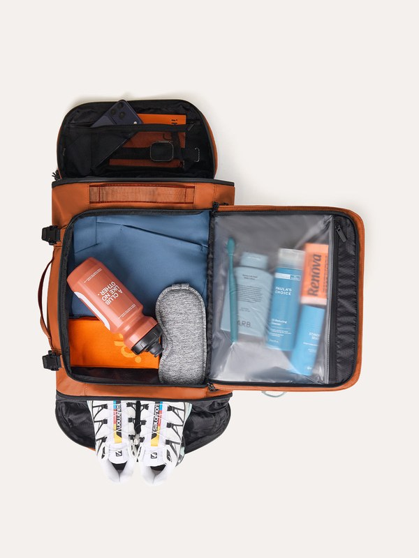 Open Bagsmart Faro 40L travel backpack showing packed clothes and toiletries inside