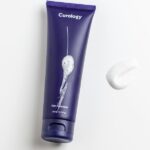 Skincare products arranged for a firming routine